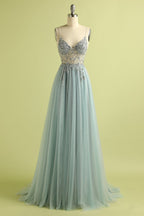 Abito lungo in tulle azzurro con ricami e perline