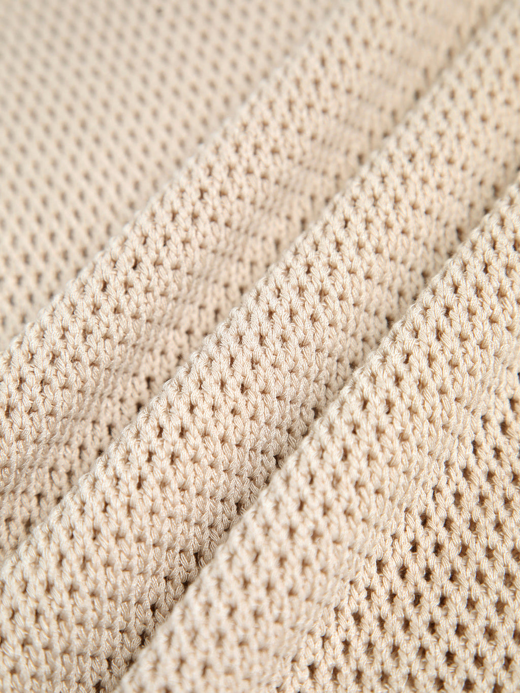Top beige senza maniche in maglia traforata
