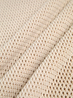 Top beige senza maniche in maglia traforata