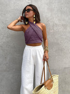 Top halter beige senza maniche con incrocio frontale