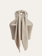 Top halter beige senza maniche con incrocio frontale