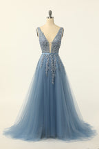 Abito da ballo in tulle blu con applicazioni in pizzo