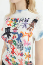 Top bianco con stampa a cartoon e maniche corte