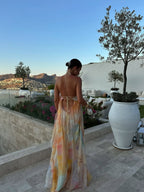 Abito lungo giallo con scollo halter in chiffon