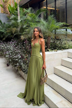Abito lungo verde corsetto in pizzo con gonna plissé – Kenley