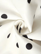 Abito corto strapless a pois neri